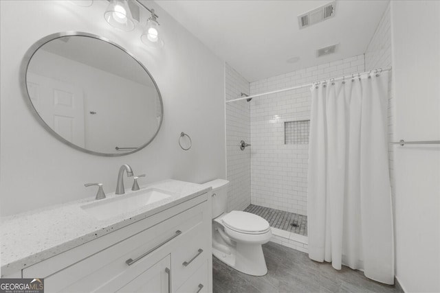 7049 Bennington Ln, Cumming, GA 30041 - full bath featuring vanity, tiled shower, and wood finished floors