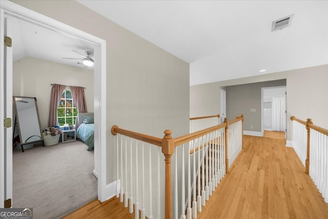 7049 Bennington Ln, Cumming, GA 30041 - hall featuring light wood-style floors and an upstairs landing