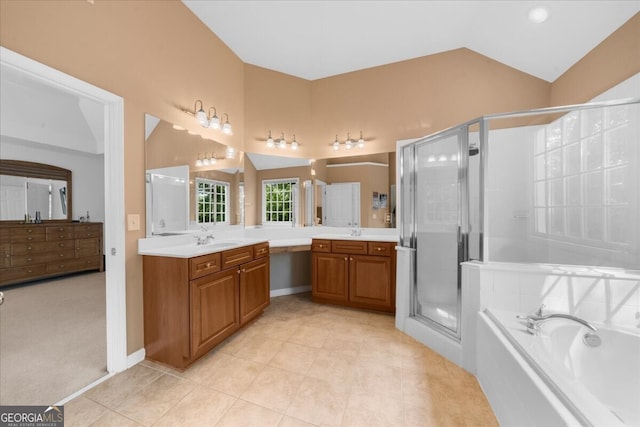 7049 Bennington Ln, Cumming, GA 30041 - bathroom with two vanities, a stall shower, a bath, lofted ceiling, and tile patterned floors
