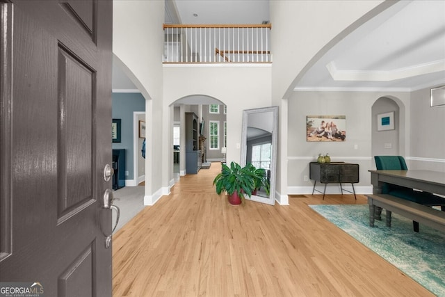 7049 Bennington Ln, Cumming, GA 30041 - foyer entrance featuring light wood-style flooring and crown molding