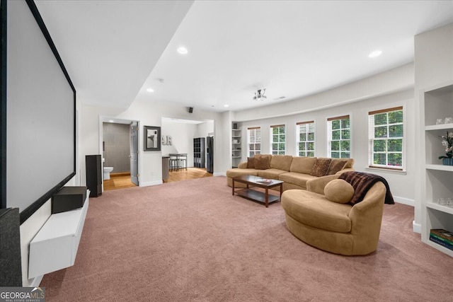 7049 Bennington Ln, Cumming, GA 30041 - carpeted living area featuring recessed lighting and built in shelves