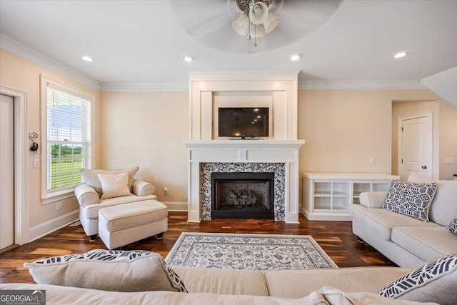 236 Woodland Trail Rd, Cochran, GA 31014 - living area with crown molding, a ceiling fan, wood finished floors, a tile fireplace, and recessed lighting