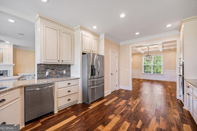 236 Woodland Trail Rd, Cochran, GA 31014 - kitchen featuring appliances with stainless steel finishes, ornamental molding, dark wood-style flooring, a chandelier, and tasteful backsplash