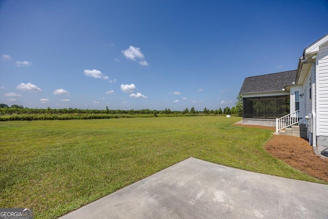 236 Woodland Trail Rd, Cochran, GA 31014 - view of grassy yard with a sunroom, a patio, and a rural view