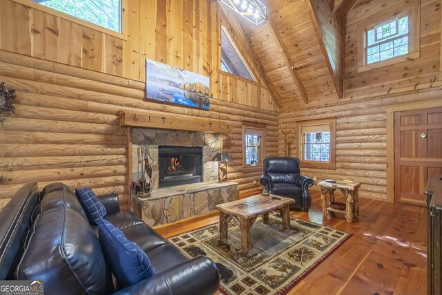 451 Pinecrest Rd, Sautee Nacoochee, GA 30571 - living area with hardwood / wood-style flooring, plenty of natural light, beamed ceiling, high vaulted ceiling, and a fireplace