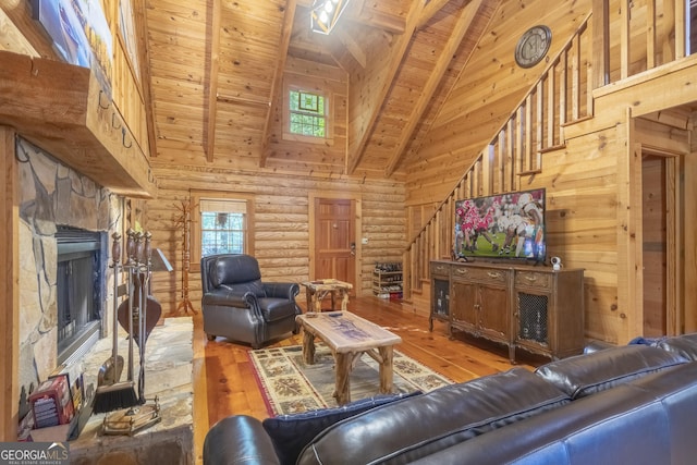 451 Pinecrest Rd, Sautee Nacoochee, GA 30571 - living area with high vaulted ceiling, stairway, hardwood / wood-style flooring, wood ceiling, and rustic walls