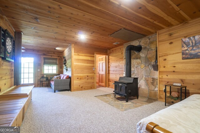 451 Pinecrest Rd, Sautee Nacoochee, GA 30571 - bedroom featuring wood ceiling, a wood stove, carpet flooring, and wooden walls