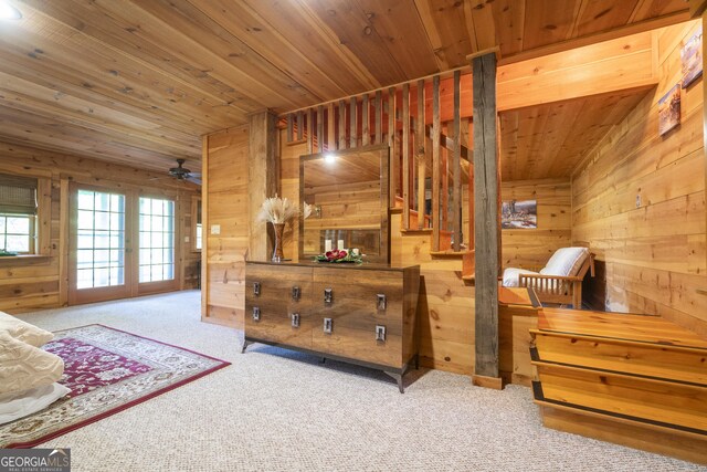 451 Pinecrest Rd, Sautee Nacoochee, GA 30571 - carpeted bedroom featuring wood walls, wooden ceiling, and access to exterior