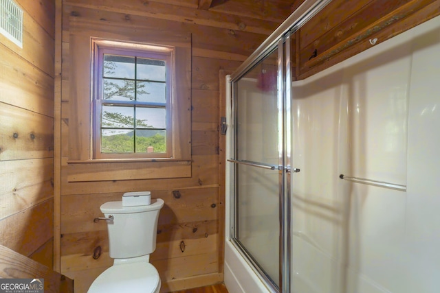 451 Pinecrest Rd, Sautee Nacoochee, GA 30571 - bathroom with wood walls, toilet, and shower / bath combination with glass door