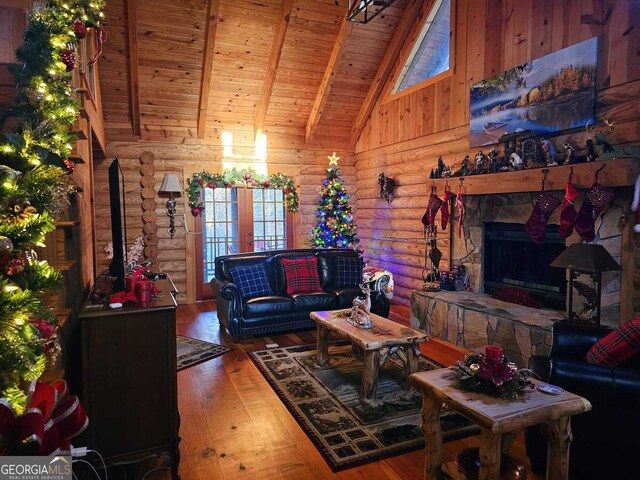 451 Pinecrest Rd, Sautee Nacoochee, GA 30571 - living room featuring wooden ceiling, hardwood / wood-style floors, rustic walls, beamed ceiling, and high vaulted ceiling