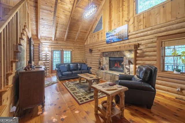 451 Pinecrest Rd, Sautee Nacoochee, GA 30571 - living area with high vaulted ceiling, hardwood / wood-style flooring, wooden ceiling, a stone fireplace, and beam ceiling