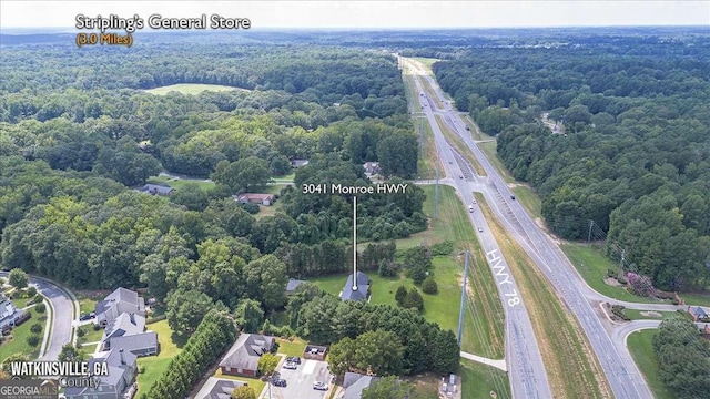 3041 Monroe Hwy, Bogart, GA 30622 - drone / aerial view of a main thoroughfare and a heavily wooded area