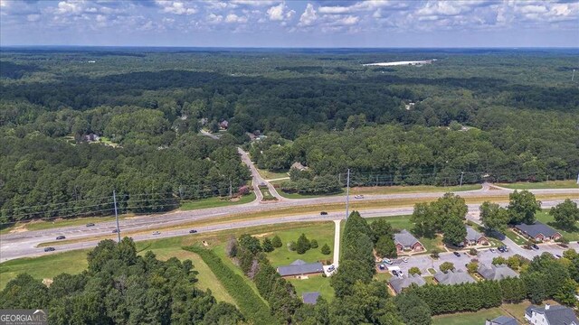 3041 Monroe Hwy, Bogart, GA 30622 - aerial overview of property's location with a heavily wooded area