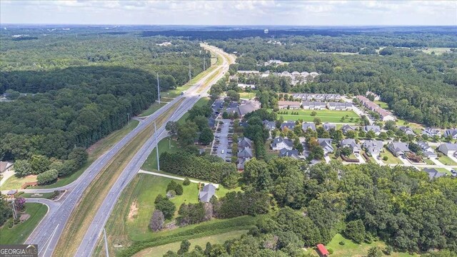 3041 Monroe Hwy, Bogart, GA 30622 - aerial view of property and surrounding area with a major roadway, a heavily wooded area, and nearby suburban area
