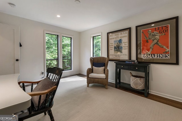 office space with baseboards, wood finished floors, and recessed lighting