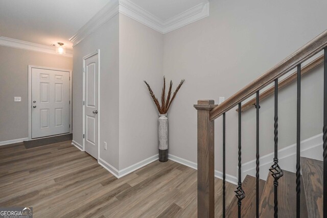 2851 Fareed St, Douglasville, GA 30135 - foyer featuring crown molding, wood finished floors, stairway, and baseboards
