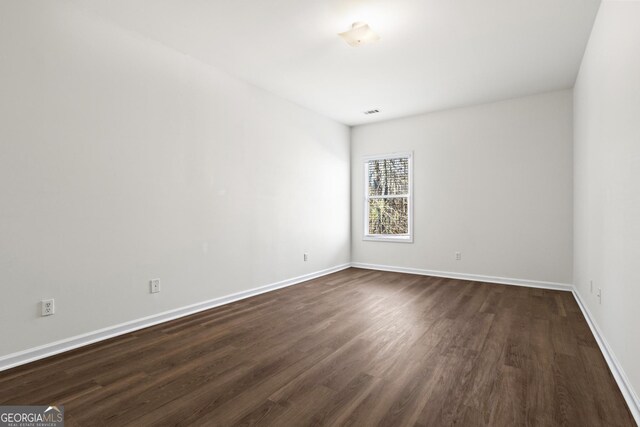 221 Cutbank Ct SW, Atlanta, GA 30331 - unfurnished room with dark wood-style floors and baseboards