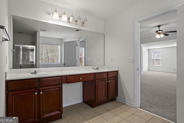 221 Cutbank Ct SW, Atlanta, GA 30331 - full bathroom featuring double vanity, plenty of natural light, tile patterned floors, and a shower stall