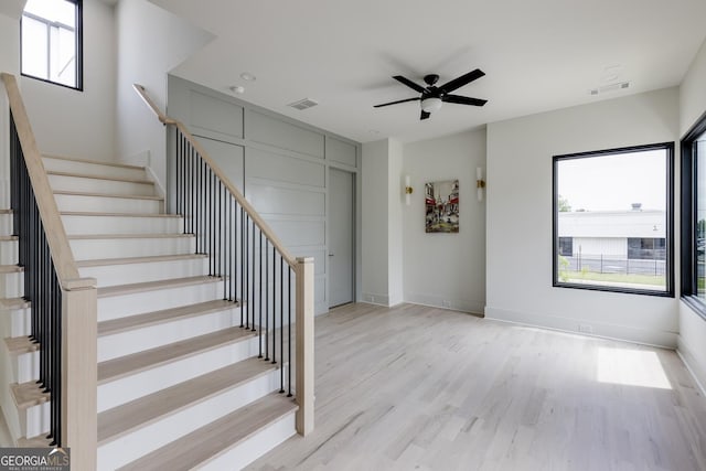 1954 8th St, Chamblee, GA 30341 - staircase with wood finished floors, ceiling fan, and baseboards