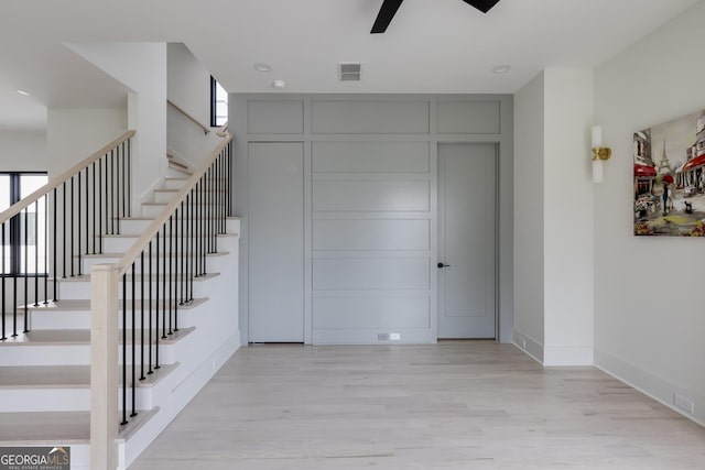 1954 8th St, Chamblee, GA 30341 - staircase featuring wood finished floors, a ceiling fan, and baseboards