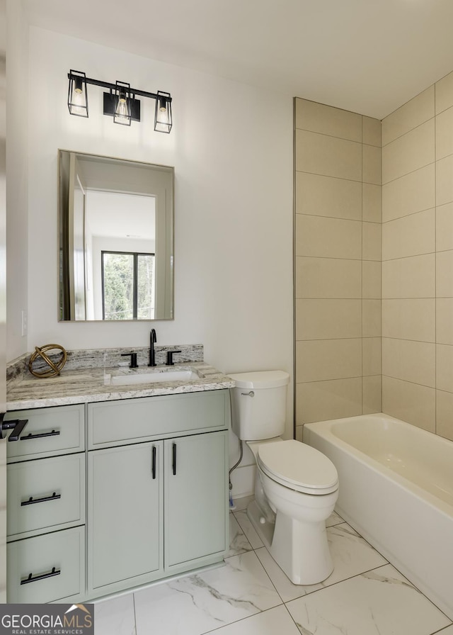 1954 8th St, Chamblee, GA 30341 - bathroom featuring marble finish floors, toilet, and vanity