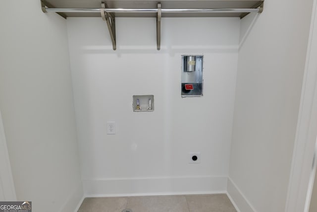 1954 8th St, Chamblee, GA 30341 - laundry room with hookup for a washing machine, hookup for an electric dryer, light tile patterned floors, and baseboards