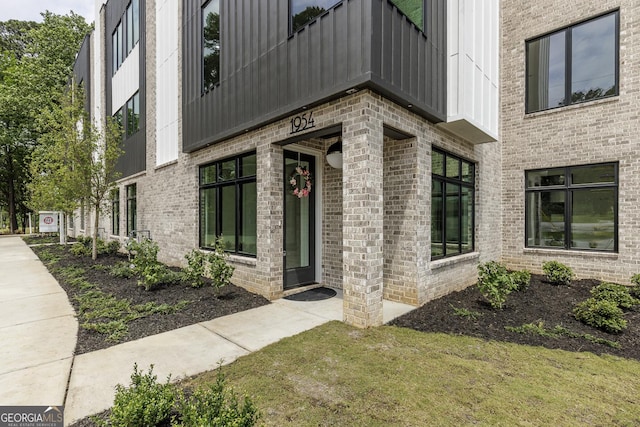 1954 8th St, Chamblee, GA 30341 - doorway to property featuring brick siding and a balcony
