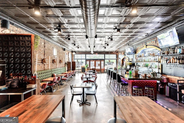 1954 8th St, Chamblee, GA 30341 - dining room with concrete flooring, a dry bar, and an ornate ceiling
