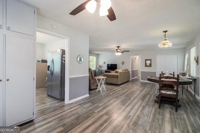 105 Tranquility Dr, Villa Rica, GA 30180 - dining room with a ceiling fan, wood finished floors, and baseboards