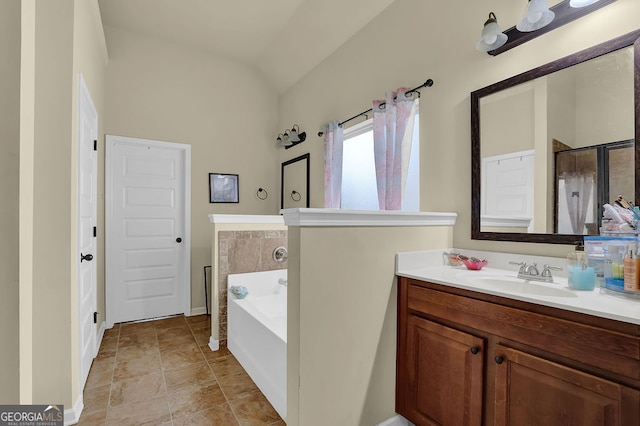 4581 Sagebrush Ct, Snellville, GA 30039 - full bathroom with a bath, vanity, vaulted ceiling, baseboards, and an enclosed shower