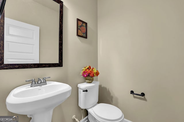4581 Sagebrush Ct, Snellville, GA 30039 - bathroom with toilet and baseboards