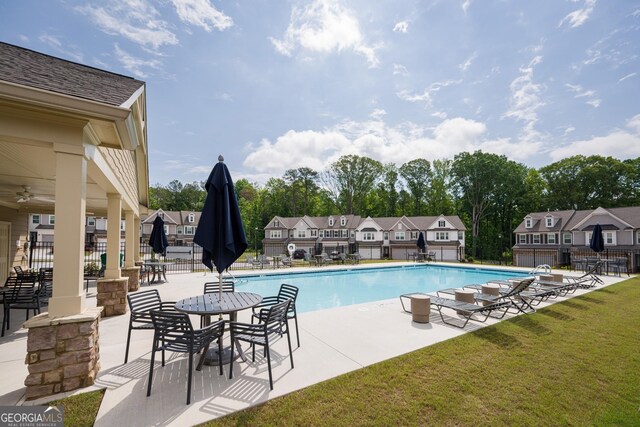 668 Isom Walk, Suwanee, GA 30024 - community pool featuring a residential view and a patio area