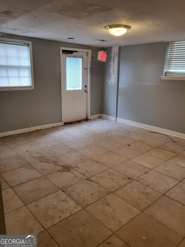957 Astor Ave, Forest Park, GA 30297 - unfurnished room featuring plenty of natural light and baseboards