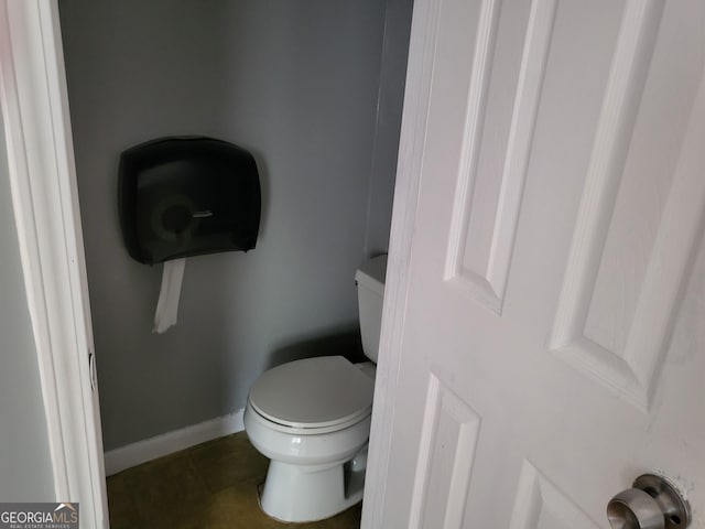 957 Astor Ave, Forest Park, GA 30297 - bathroom with toilet, tile patterned floors, and baseboards