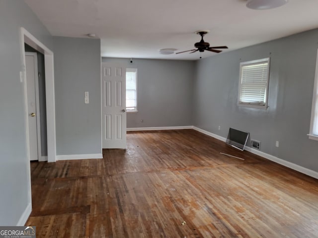 957 Astor Ave, Forest Park, GA 30297 - empty room with wood finished floors, baseboards, and a ceiling fan