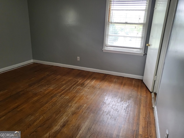 957 Astor Ave, Forest Park, GA 30297 - unfurnished room with dark wood-style flooring and baseboards
