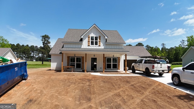 1573 Cabin Creek Trl, Griffin, GA 30223 - modern inspired farmhouse featuring board and batten siding, roof with shingles, covered porch, driveway, and an attached garage