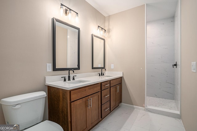 1573 Cabin Creek Trl, Griffin, GA 30223 - full bath with marble look tile flooring, double vanity, toilet, a marble finish shower, and baseboards