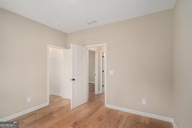 1573 Cabin Creek Trl, Griffin, GA 30223 - unfurnished room with baseboards, light wood-style flooring, and a smoke detector