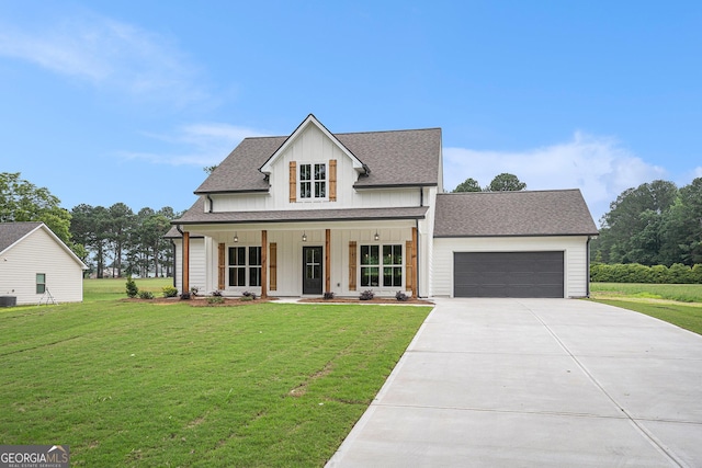 1573 Cabin Creek Trl, Griffin, GA 30223 - modern farmhouse with driveway, an attached garage, a front lawn, and board and batten siding