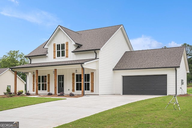 1573 Cabin Creek Trl, Griffin, GA 30223 - modern farmhouse featuring concrete driveway, a garage, roof with shingles, and a front lawn