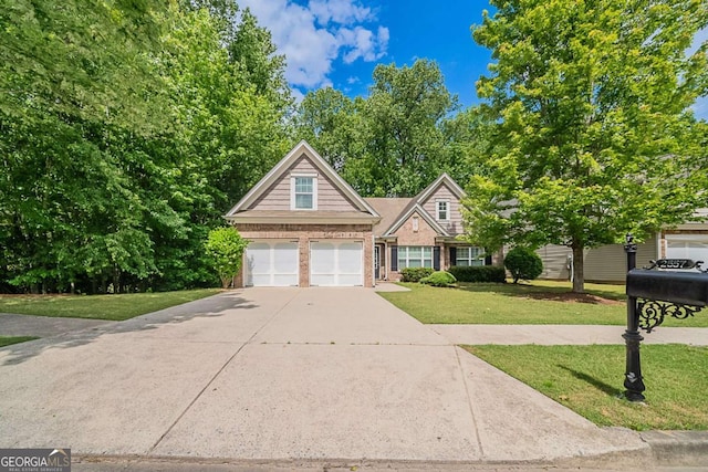 traditional-style home with a front yard, driveway, an attached garage, and brick siding
