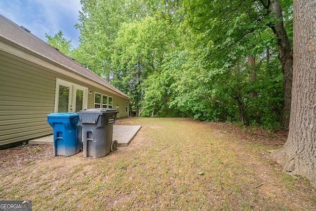 view of yard featuring french doors