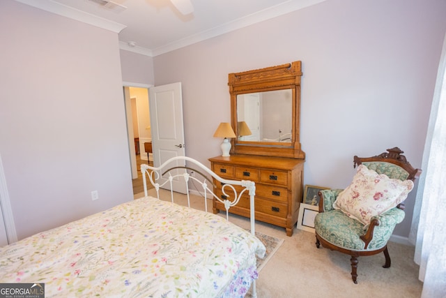 bedroom with ornamental molding, carpet flooring, and ceiling fan