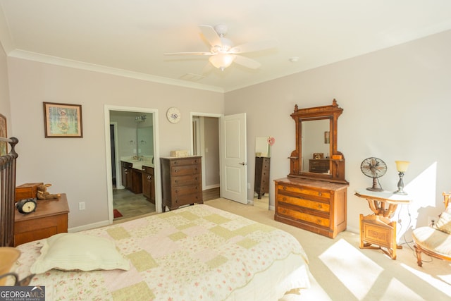 bedroom with light carpet, ornamental molding, ceiling fan, ensuite bathroom, and baseboards