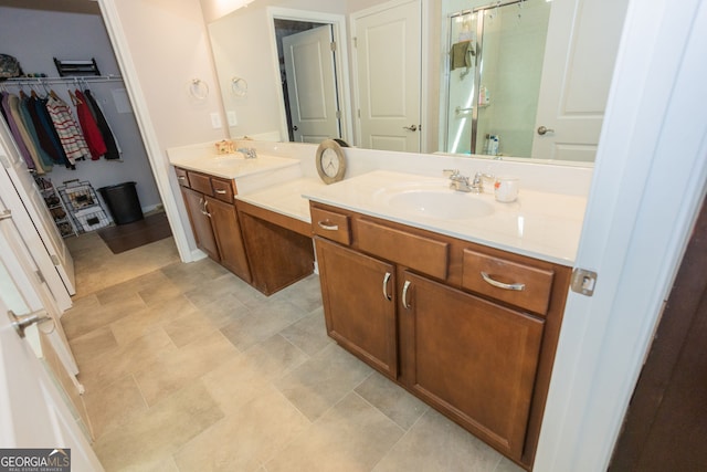 full bath featuring double vanity and a spacious closet