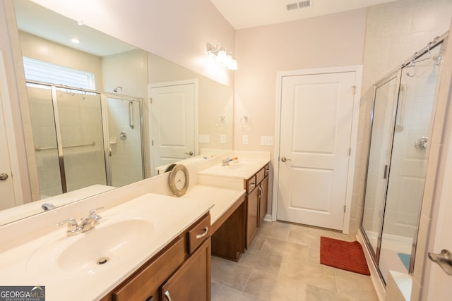full bath with a stall shower and double vanity