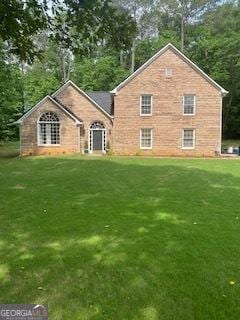 view of front of home with a front lawn