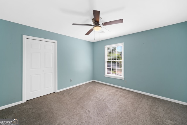 8035 Canter Ln, Alpharetta, GA 30009 - unfurnished bedroom with a closet, carpet floors, baseboards, and ceiling fan