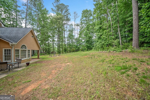8035 Canter Ln, Alpharetta, GA 30009 - view of grassy yard with a patio area
